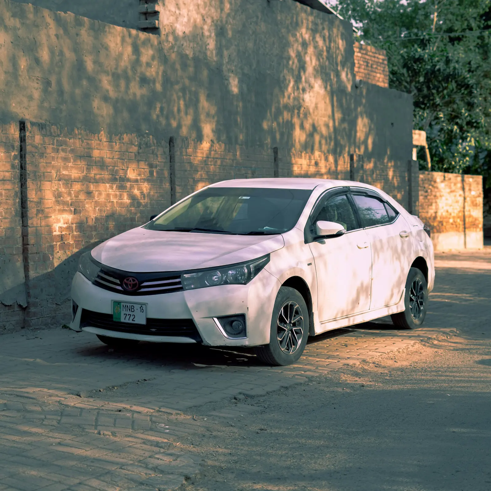 White Toyota Corolla parked on a street
