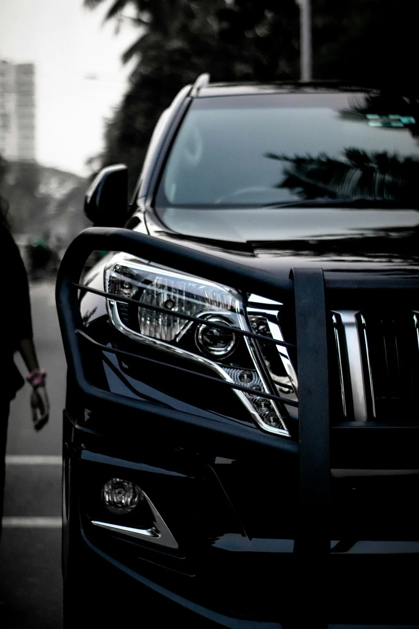 Black Toyota Prado front at night
